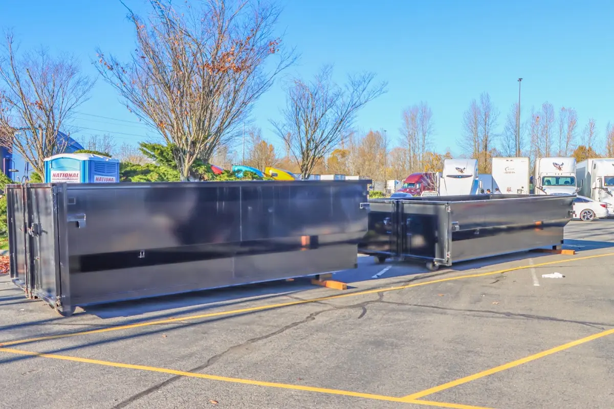 Professional dumpster rental service with roll-off container on residential driveway in Severna Park